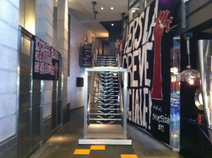 View of the banner exhibit in the hallway leading to the stairs in the lobby of Cinéma Excentris.